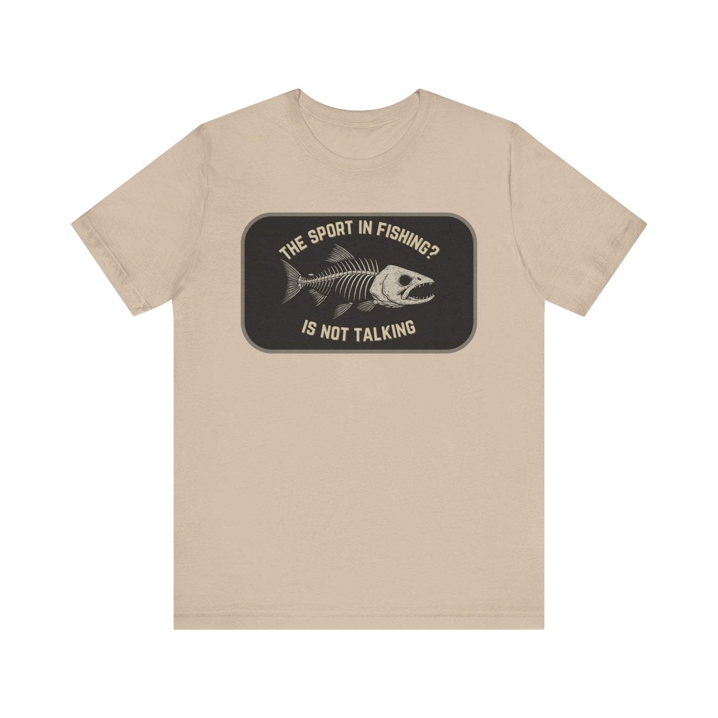 Printify’s “The Sport in Fishing?” Tee is a beige unisex shirt with a distressed fish skeleton and the text “The sport in fishing? is not talking” inside a dark rectangle—vintage-inspired, perfect for fishing fans.