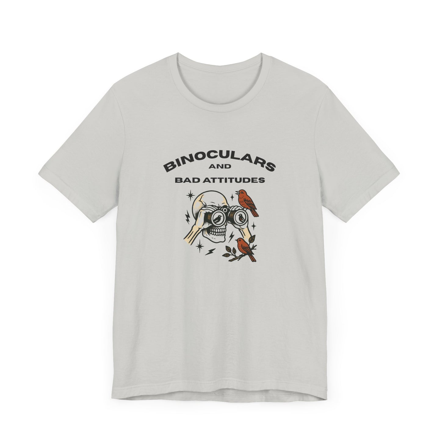 The Bird Watching Is Hardcore T-Shirt by Printify is a funny punk birder shirt for misfits and field freaks, featuring a skull with binocular eyes, birds, and sparks—perfect for edgy ornithologists. “BINOCULARS AND BAD ATTITUDES” tops the design.