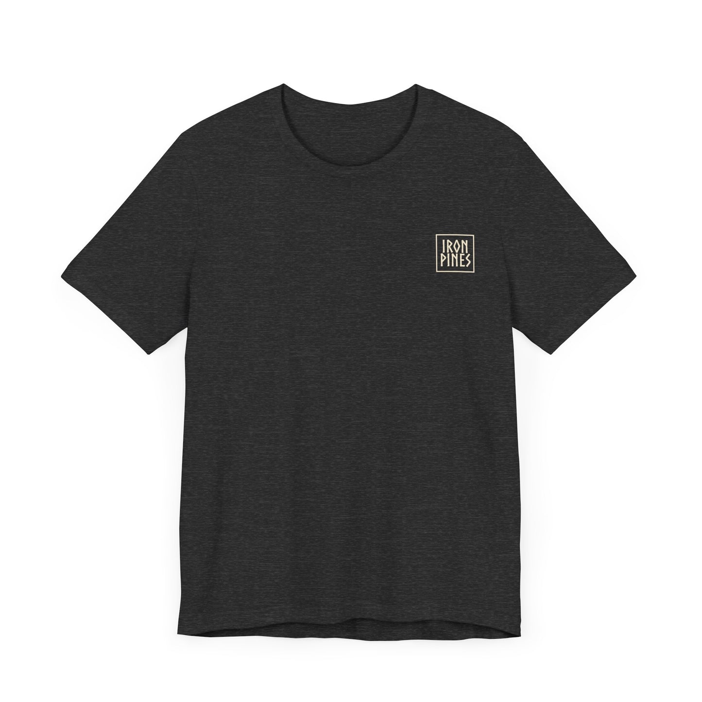 The Iron Pines Crest Tee by Printify is a black, sustainable Airlume cotton t-shirt with a small white rectangular logo on the left chest, shown on a white background.