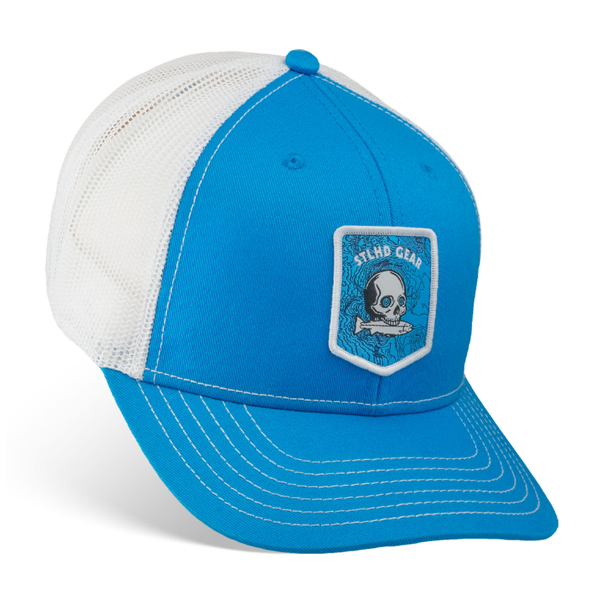 Blue and white cap with a STLHD GEAR skull and fish patch on a white background