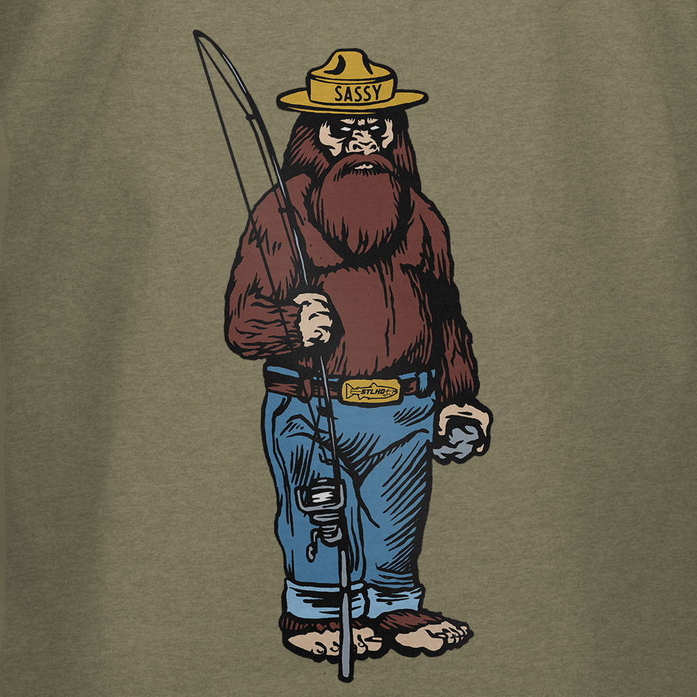 Featuring a bigfoot in blue jeans, yellow Sassy hat, and Sasquatch belt buckle with fishing pole and fish, this illustration channels STLHD GEAR’s adventurous spirit on the Men’s Danger Ranger T-Shirt against an olive-green backdrop.