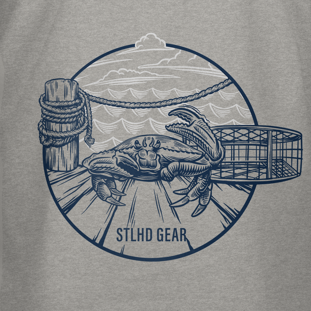 The STLHD Mens Crabby T-Shirt by STLHD GEAR features a crab on a pier with trap, rope post, waves, and clouds, plus “STLHD GEAR” text—ideal for fishing enthusiasts who love classic crab designs.