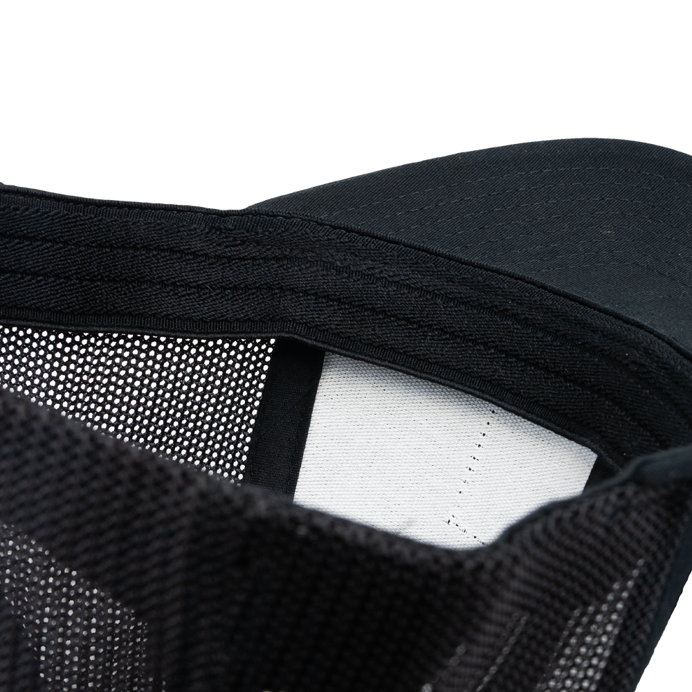 Close-up of the STLHD GEAR Beaver State Flex Fit Trucker Hats interior, showing detailed stitching, mesh panel, and a blank white tag—highlighting the quality construction and comfort of this premium trucker hat.