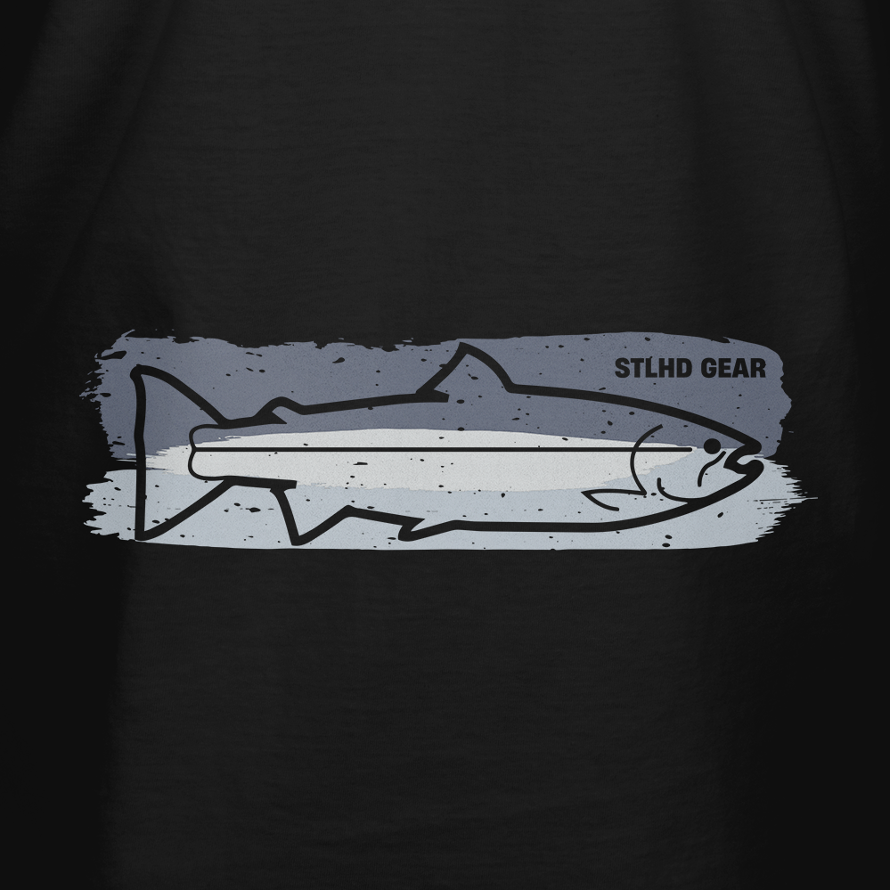 The STLHD Chrome T-Shirt by STLHD GEAR features a black fish outline on a blue and gray brushstroke background with the brand’s logo—ideal for outdoor enthusiasts and fishing fans.