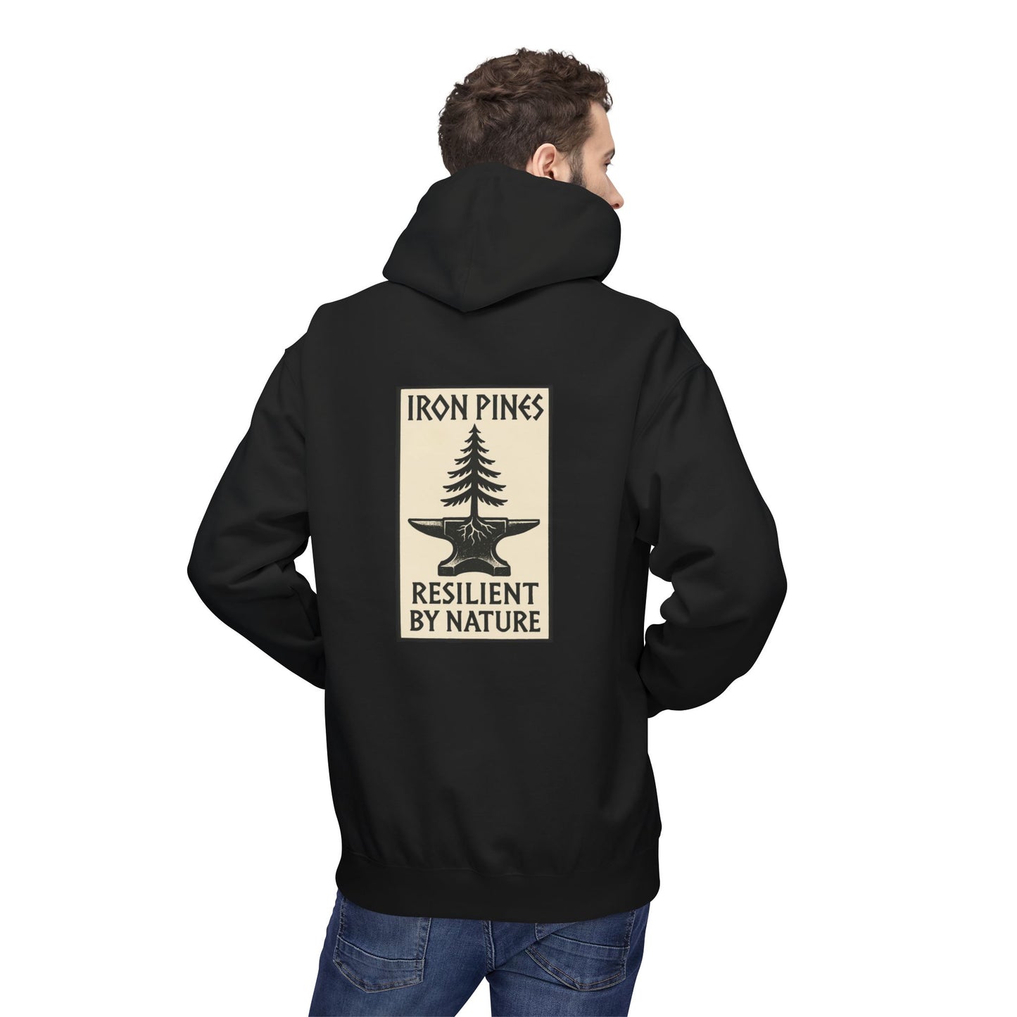 A man faces away from the camera wearing The Iron Pines Hoodie by Printify, featuring a midweight fleece, pine tree and anvil design, and Iron Pines Resilient By Nature text—an embodiment of sustainable outdoor style.