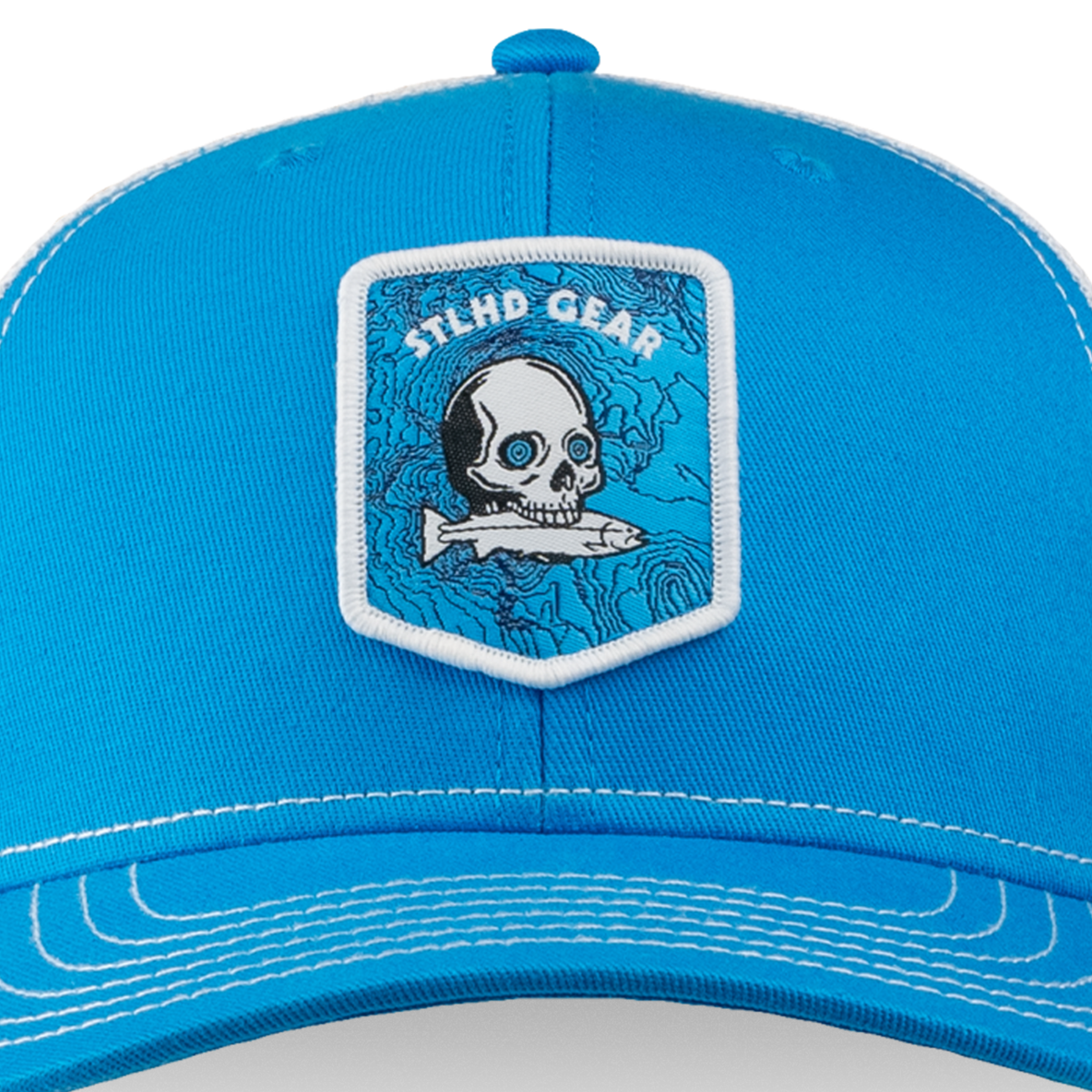 Blue cap with a  STLHD GEAR skull and fish patch on a white background