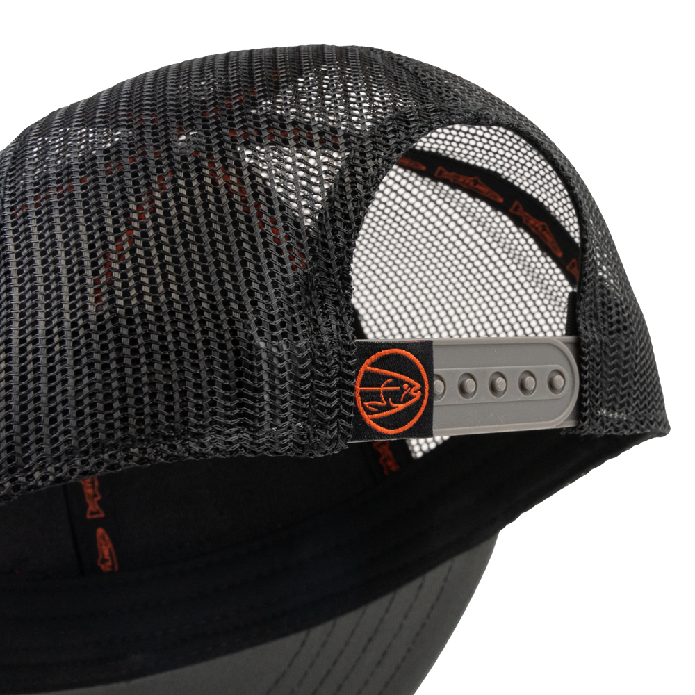 Close-up of the STLHD GEAR Never Not Fishing Trucker Hat’s back, showing black mesh and an adjustable snapback with a small orange fish logo tag—ideal for those who love classic fishing trucker hat style.