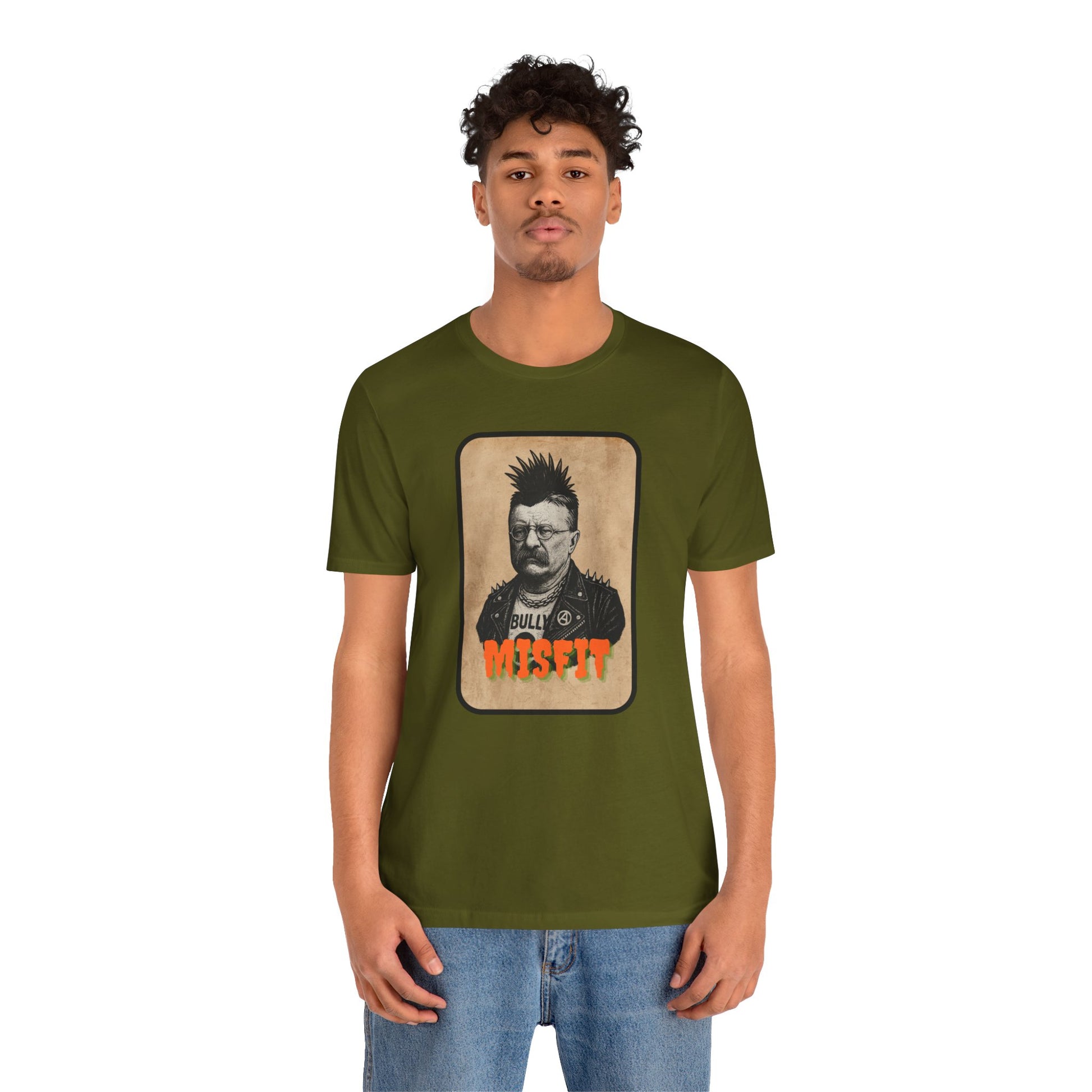 A young man wears the Iron Pines Teddy Roosevelt Punk T-Shirt, featuring an illustrated punk Teddy, BULLY on his jacket, and bold orange MISFIT under the image—a standout Misfit History tee for rebels, patriots, and wild hearts.