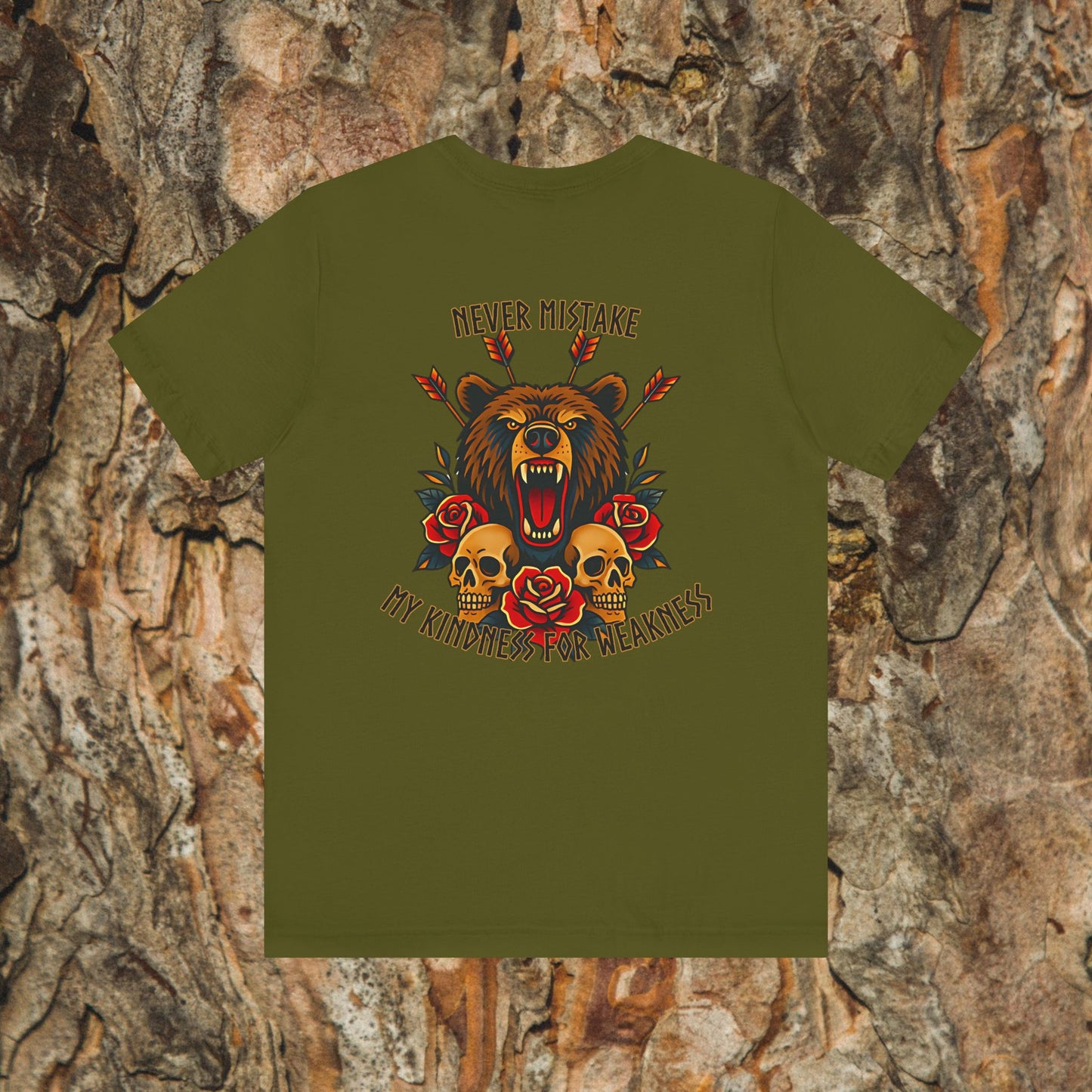 The Never Mistake My Kindness For Weakness Tee by Printify features a roaring bear, red roses, skulls, arrows, and bold text on an Airlume cotton unisex shirt with a tree bark background.