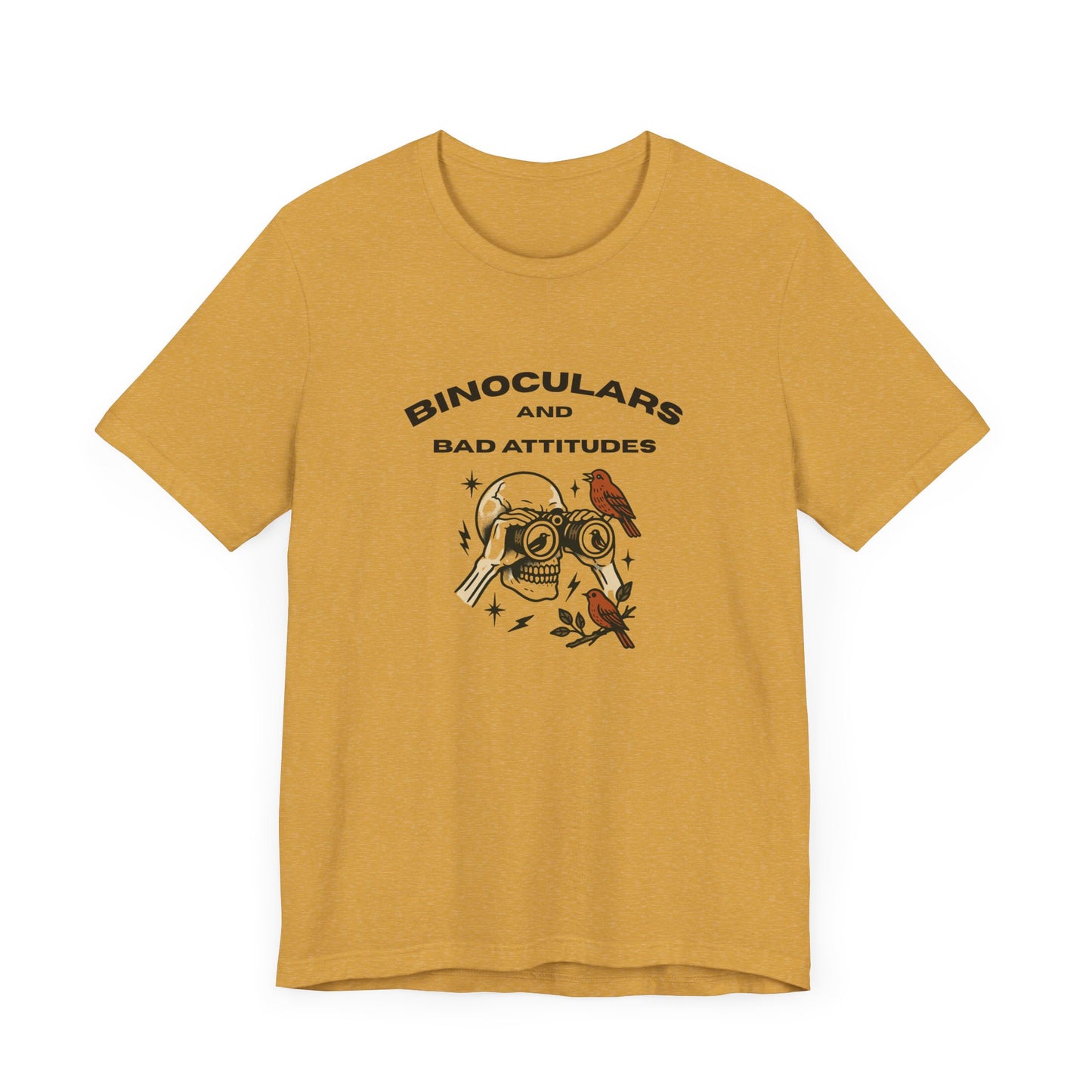 The Bird Watching Is Hardcore T-Shirt by Printify is a funny punk birder shirt for misfits and field freaks, featuring a yellow design with an illustrated skull, binocular eyes, bird, and “BINOCULARS AND BAD ATTITUDES” text.