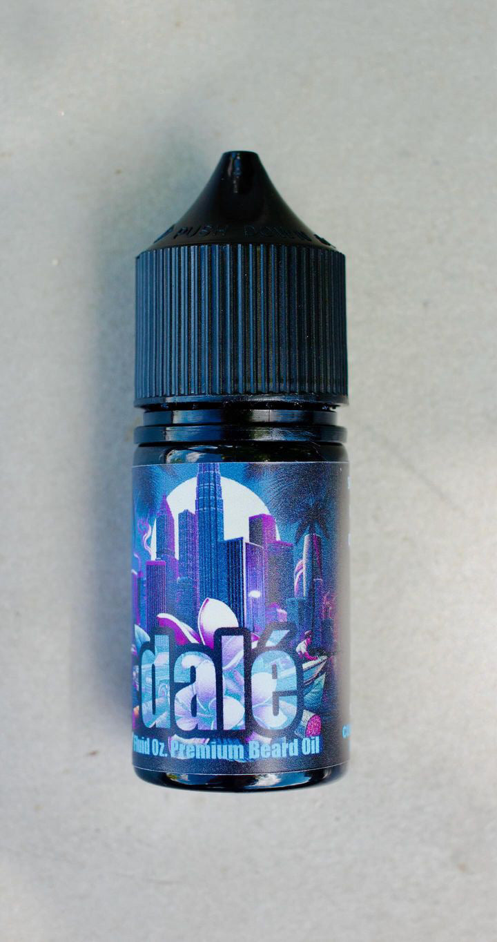 A small bottle of Bedlam Beard Company’s DALÉ Beard Oil & Balm, featuring a city skyline and palm trees on its label, sits against a plain light background—a perfect addition to any beard grooming kit.
