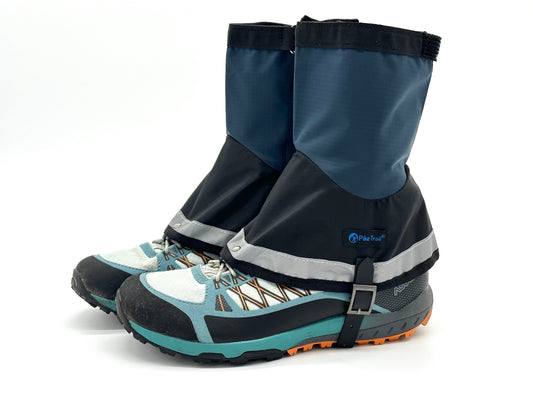 The Pike Trail Mid-Length Gaiter (Small/Medium Adjustable Fit) by Pike Trail features blue and black colors, straps for secure fit, and reflective details, offering protection from debris and moisture during trail runs.