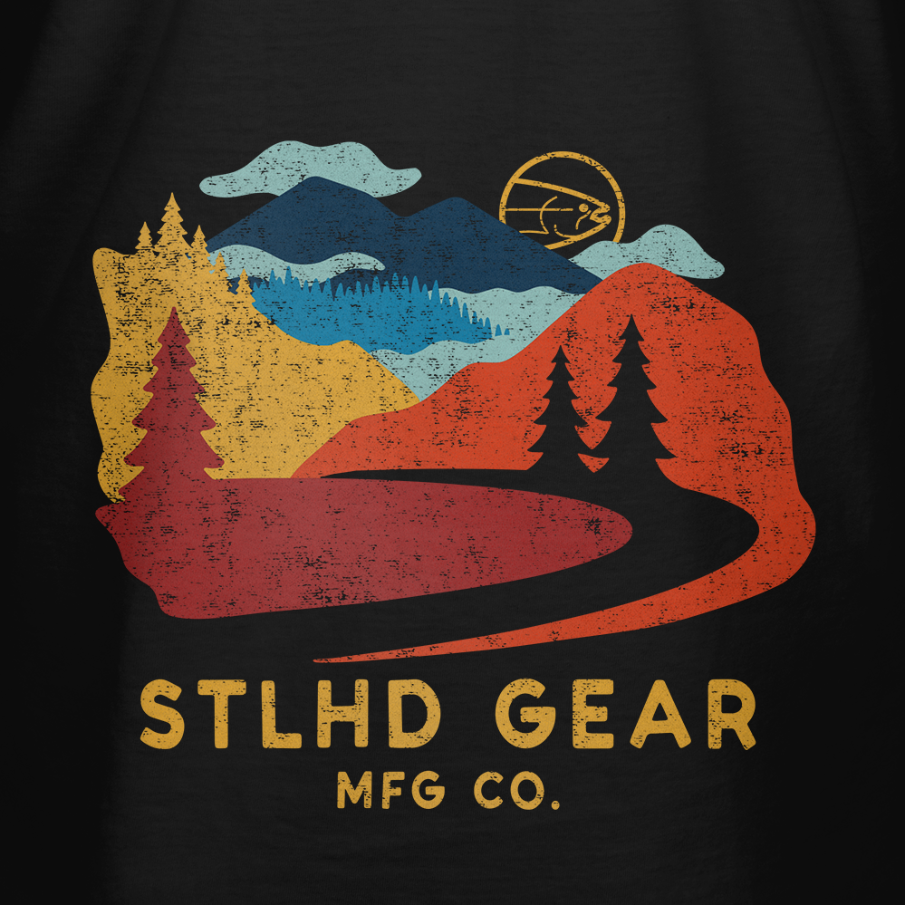 Black t-shirt with a colorful Journey graphic and 'STLHD GEAR MFG CO.' text on a dark background