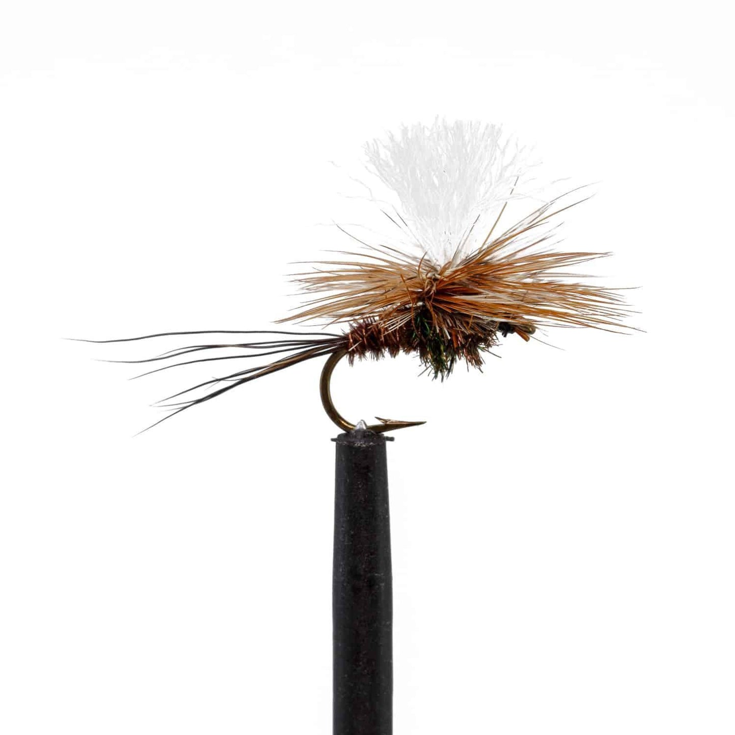 A close-up of a Jackson Hole Fly Company fly from the JHFLYCO Snake River Guides Choice Fly Box, featuring brown and tan hackle, a bushy body, white tuft on top, and sharp curved hook displayed on a black stand against a white background.