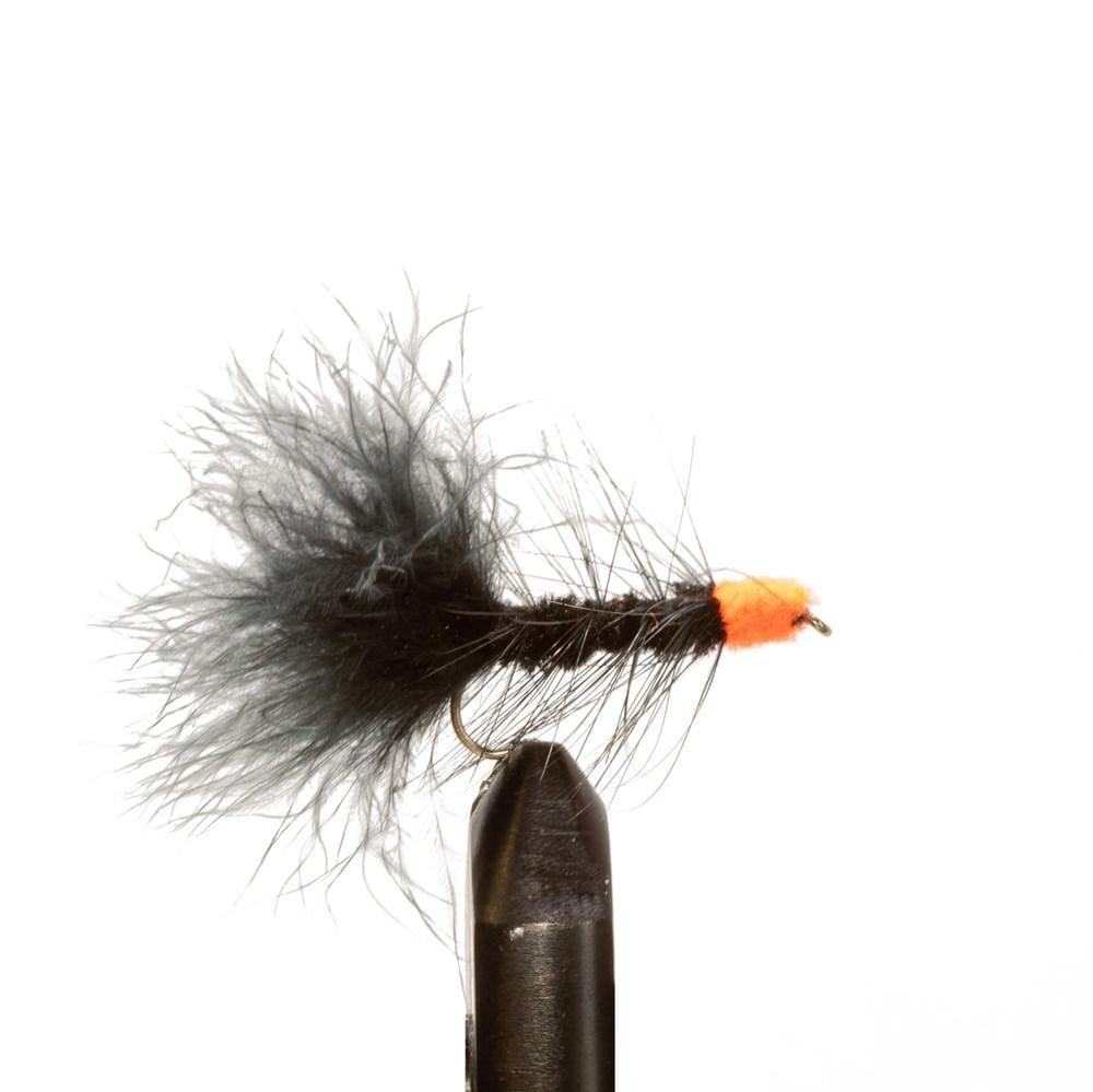 The Jackson Hole Fly Company JHFLYCO Steelhead Fly Box includes 24 spey fishing flies, featuring black and orange styles with fluffy tails, shown upright in a clamp against a plain white background.