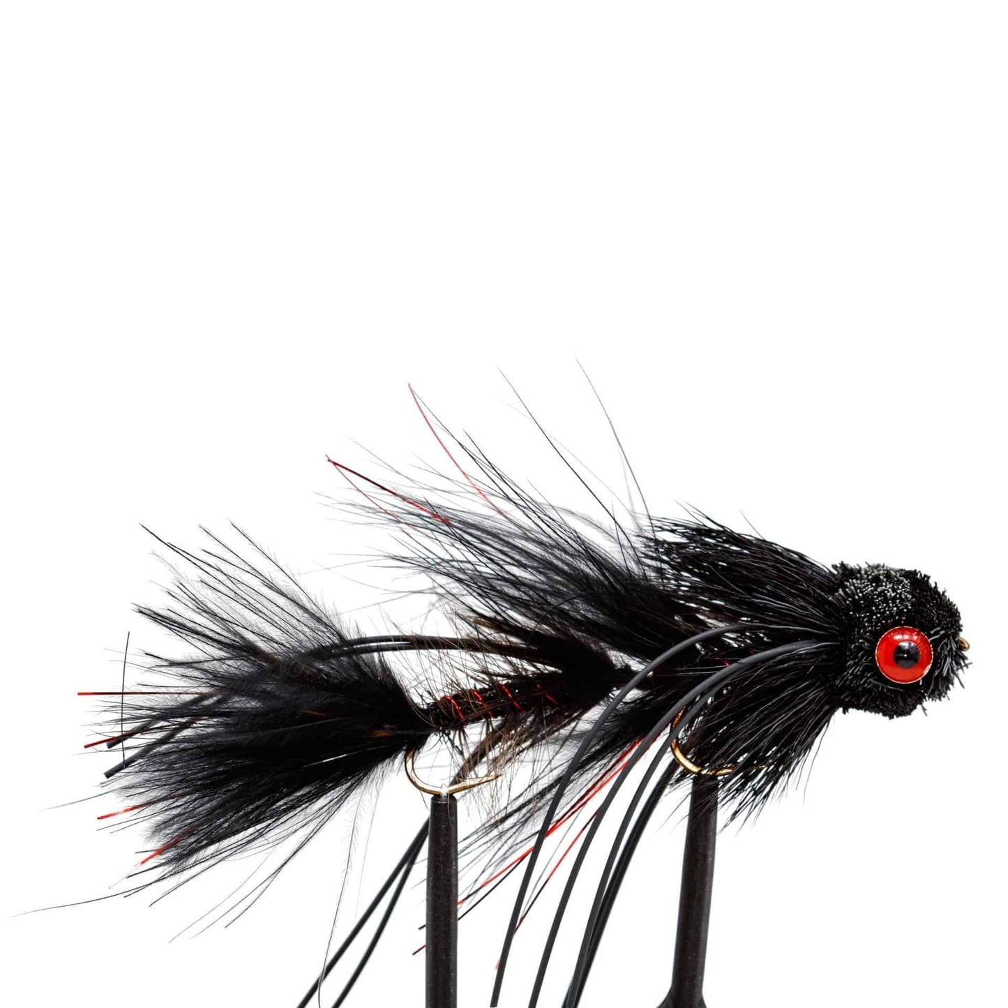 A close-up of a Jackson Hole Fly Company lure from the JHFLYCO Snake River Guides Choice Fly Box—handcrafted with feathers and synthetics, black with red accents—set against white. Perfect for enhancing your Cutthroat Country fly collection.
