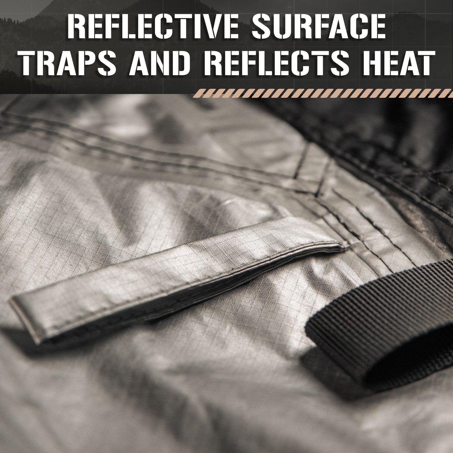 Close-up of the TACAMO® Bushcraft Reflective Shelter Tarp by TITAN Survival, showing its silver reflective surface with stitched details and black straps. Overlaid text: Reflective Surface Traps and Reflects Heat.