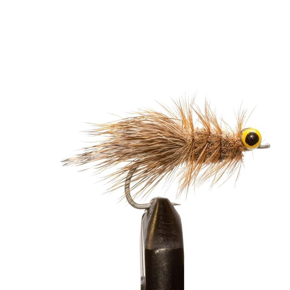 A close-up of a hand-tied fly from the Jackson Hole Fly Company’s JHFLYCO Loaded Foam Fly Box - Redfish Assortment, featuring brown and tan fibers, bushy body, curved hook, and bold yellow-black eyes against a white background.