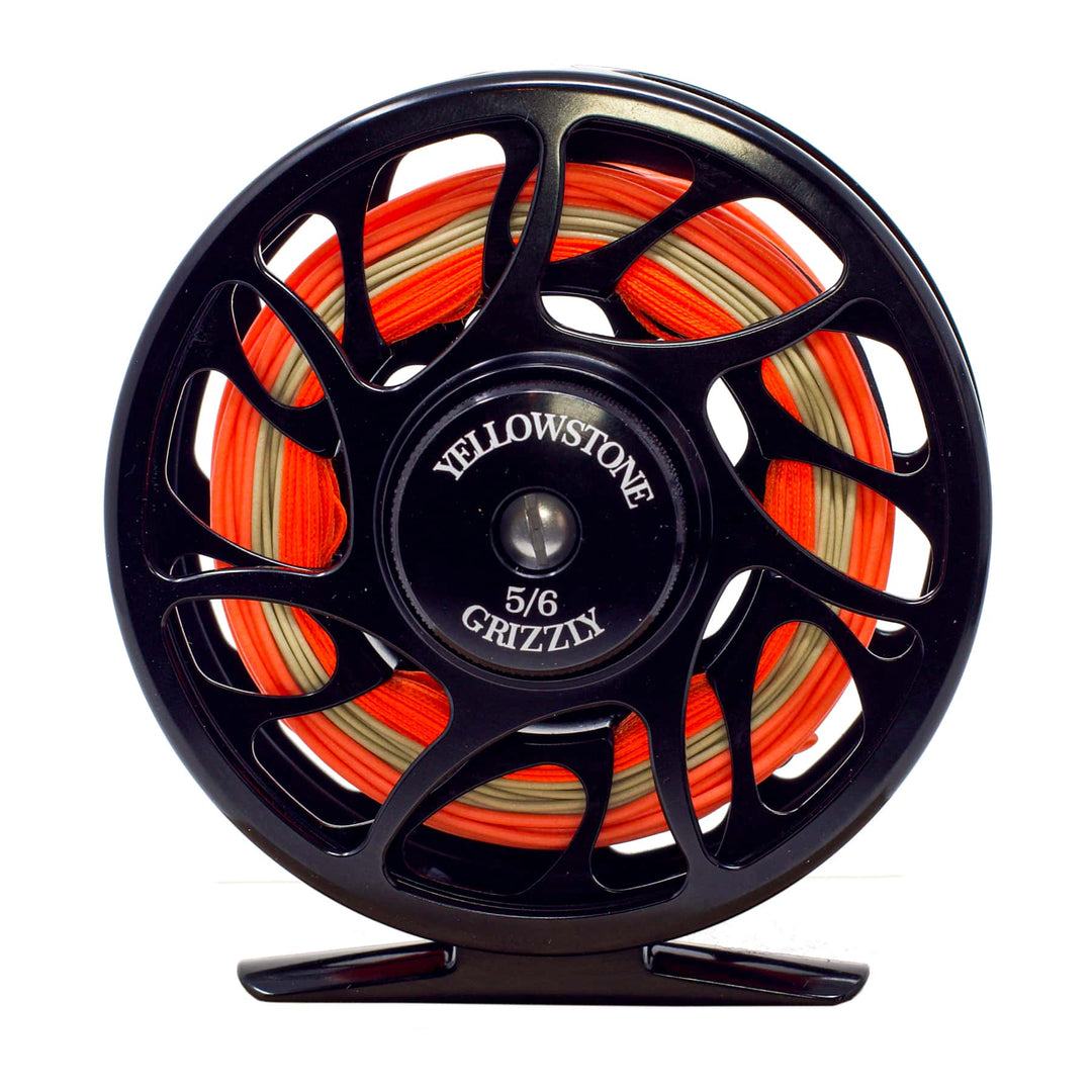 A black Yellowstone Grizzly 5/6 fly reel with orange and beige line, shown from the front—an ideal match for your Jackson Hole Fly Company Dream Stream Rod Combo Kit – 8'6" 6WT.