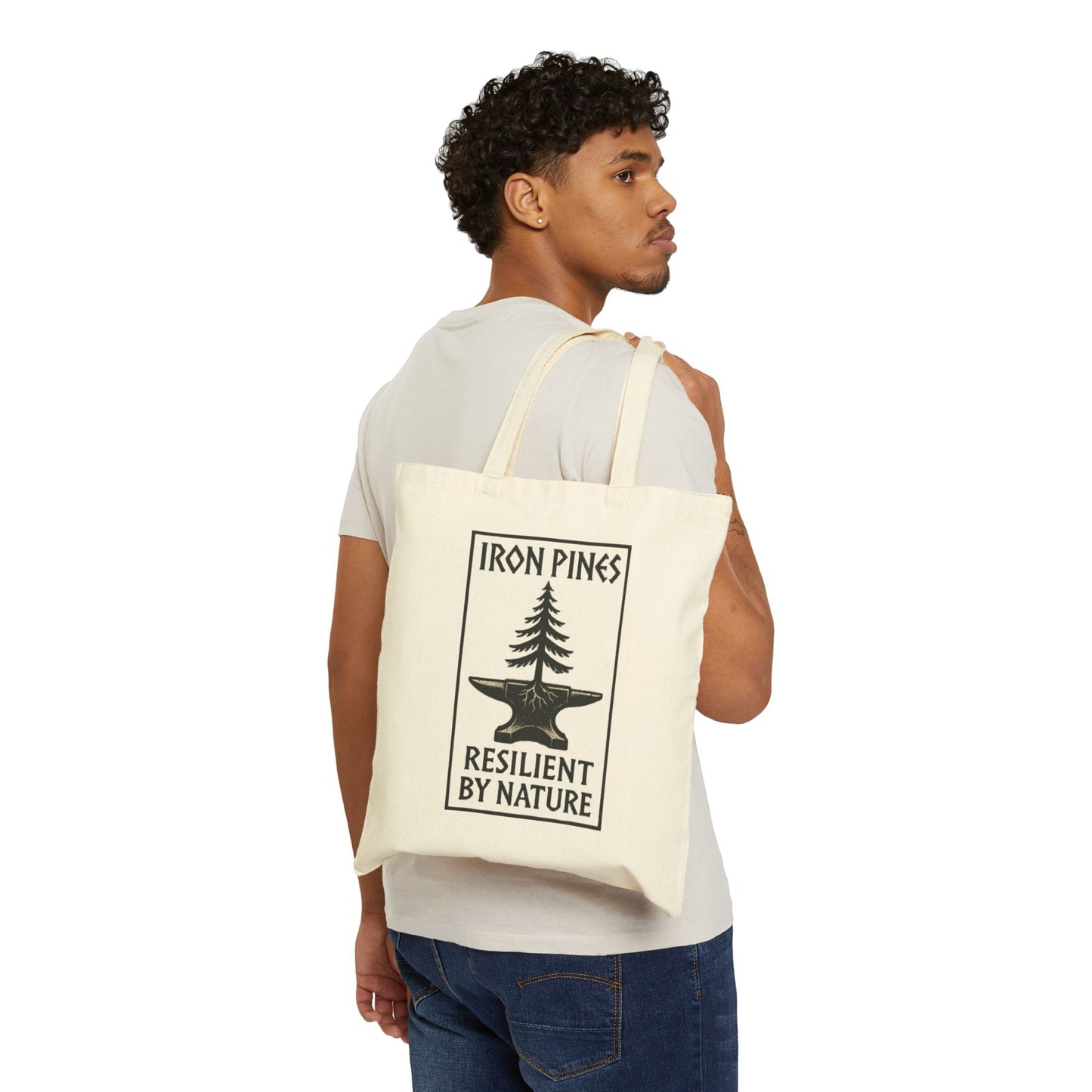 Man carrying Iron Pines Canvas Tote Bag with Resilient by Nature logo – eco-conscious natural cotton tote for everyday use