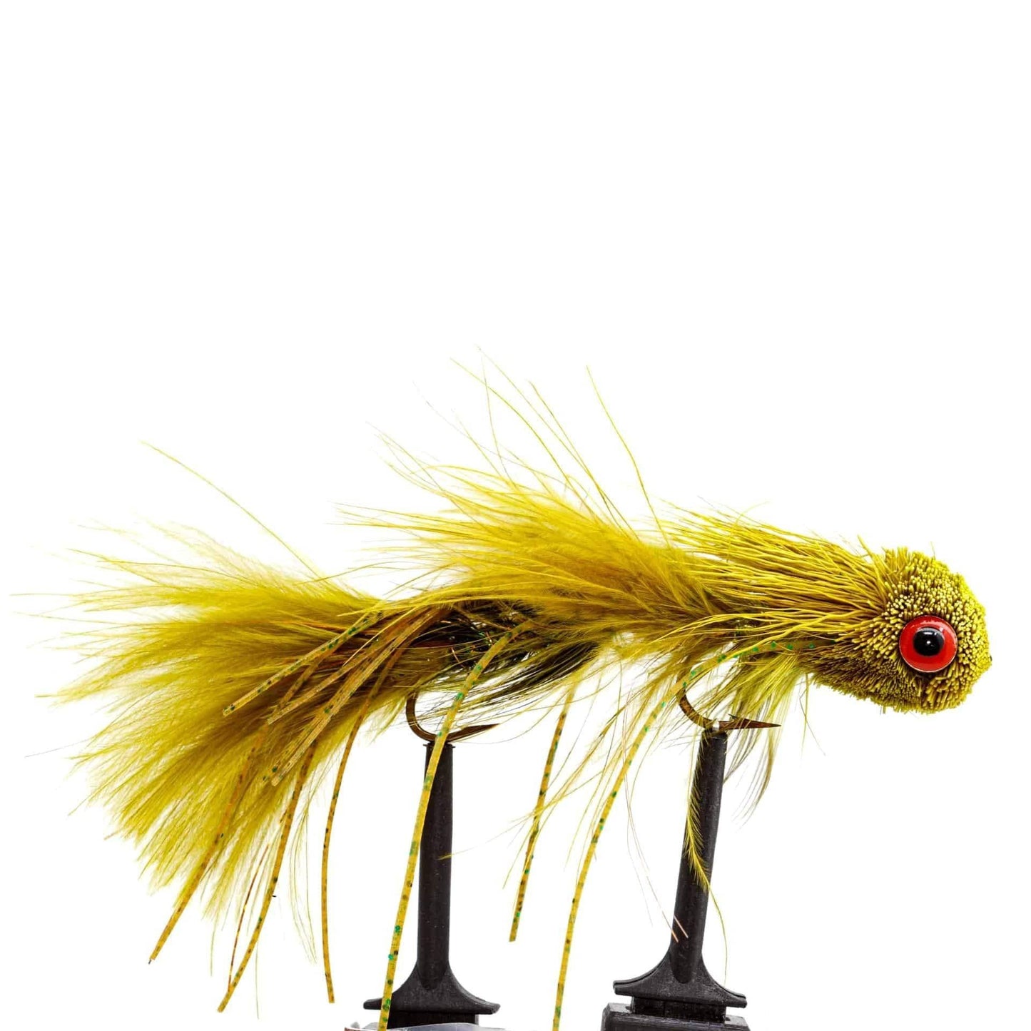 A bright olive green fishing fly with a fuzzy body, feathery tail, and large red eye from the Jackson Hole Fly Company JHFLYCO Loaded Foam Fly Box – Large Streamer Assortment (10 Flies), shown upright on a black stand against a white background.