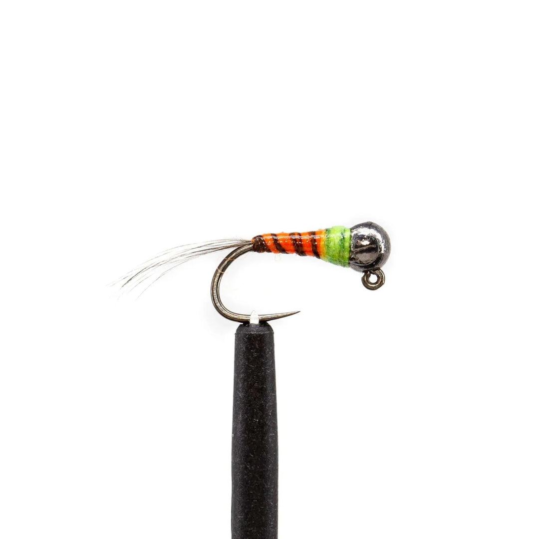A detailed shot of a Euro nymph from the Jackson Hole Fly Company’s JHFLYCO Loaded Foam Fly Box Assortment, highlighting its metallic bead head, vibrant orange, black, and green threads, and feather tail on a white background.