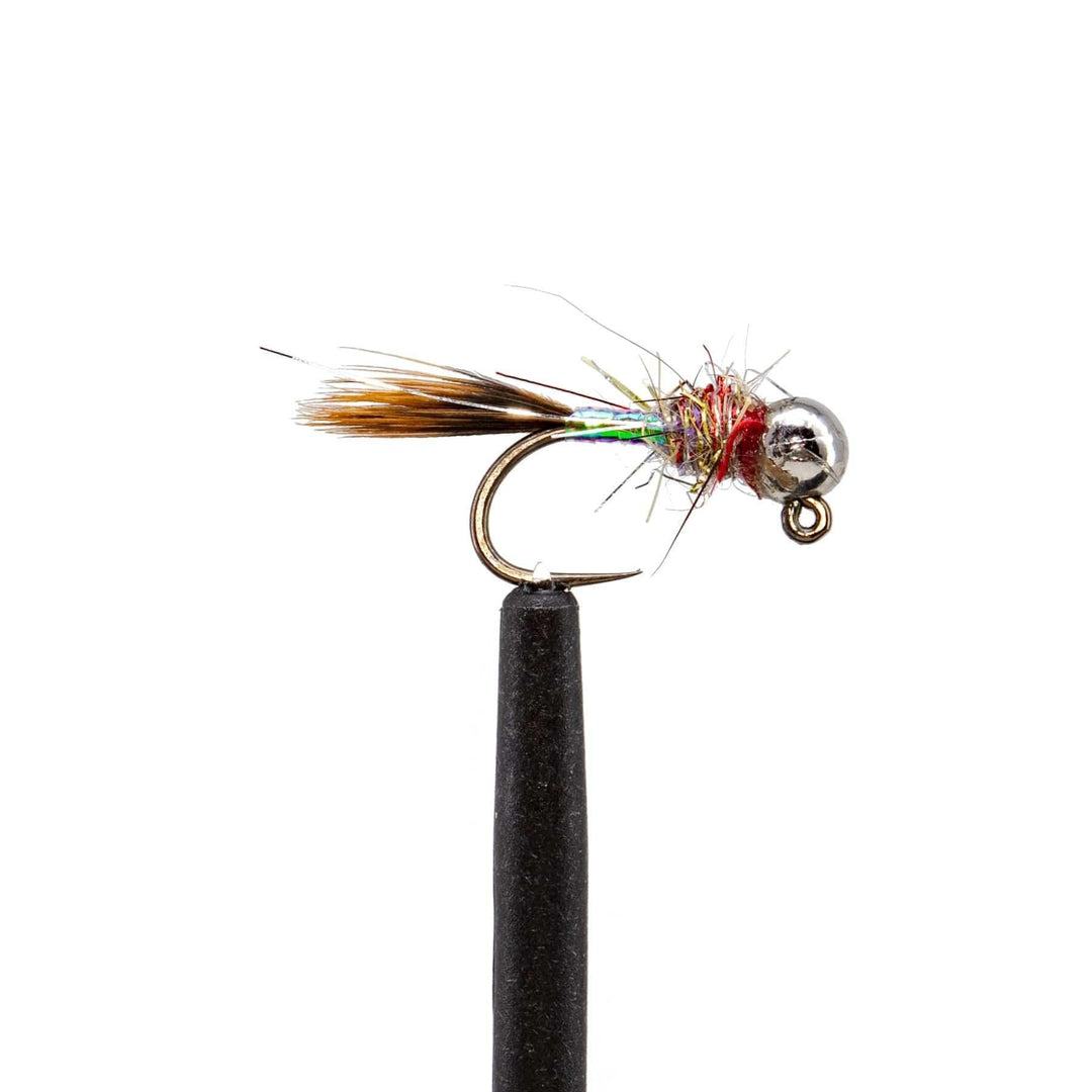 A close-up of a Jackson Hole Fly Company JHFLYCO Loaded Foam Fly Box Hopper Dropper fly, featuring a metallic bead head, brown tail, and iridescent body—an essential for trout anglers—mounted on a black stand against a white background.