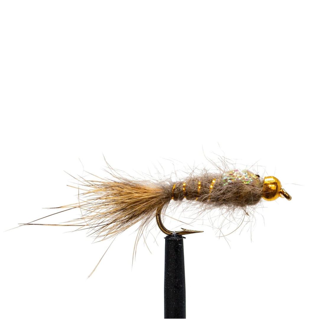 Close-up of a nymph fly from the JHFLYCO Loaded Foam Fly Box – Standard Nymph Assortment by Jackson Hole Fly Company, featuring a gold bead head, brown and tan fuzzy body, and brown tail on a black hook against a white background.