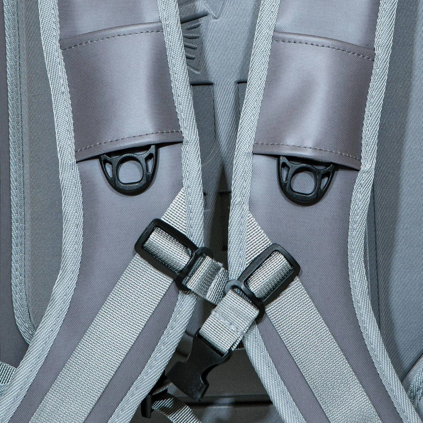 Close-up of JHFLYCO 27L Waterproof Backpack by Jackson Hole Fly Company shows grey 500D PVC shoulder straps with black D-rings, adjustable straps, and detailed stitching for durability. Ready for the Wild.