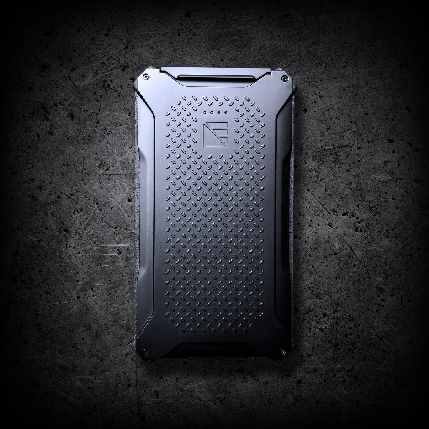 The Entropy Survival Off Grid Survival Power Bundle is a rugged, black, rectangular external hard drive with a textured surface and beveled edges—designed for reliable power in any off-grid situation.