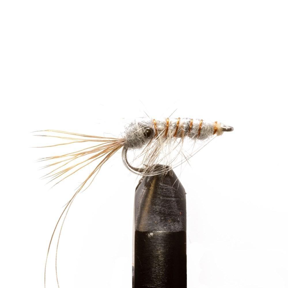A detailed view of a hand-tied fly from the Jackson Hole Fly Company’s JHFLYCO Loaded Foam Fly Box - Redfish Assortment, featuring a segmented body and bushy hackle, mounted on a hook in a black vise against a white background.