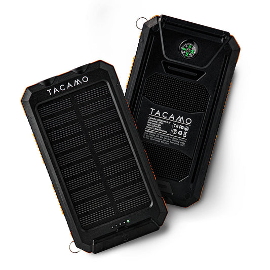 Two black TITAN Survival TACAMO Solar USB Power Banks (10,000mAh) are shown: one highlights the solar panel, LED indicators, and flashlight; the other displays the rugged waterproof back with compass and product details.