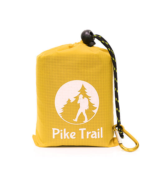 The Pike Trail Pocket Blanket comes in a yellow drawstring bag with a carabiner and features the Pike Trail logo of a hiker and trees—compact, rugged, and always ready for your adventures.