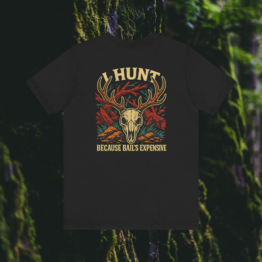 The “I Hunt Because Bail’s Expensive Tee – Iron Pines Original” by Printify is a black unisex shirt with a deer skull, antlers, red leaves, and orange-yellow accents, displayed against a mossy forest background.