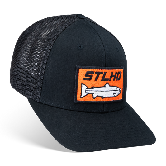 Show off your STLHD Beaver State pride in the STLHD GEAR Beaver State Flex Fit Trucker—a black mesh hat with an orange rectangular patch featuring STLHD above a white fish illustration.