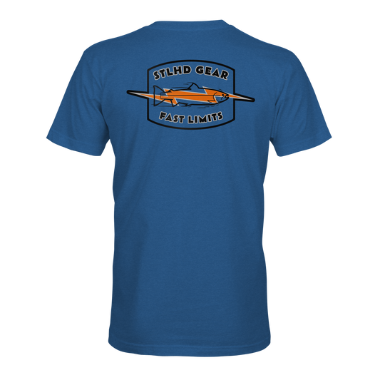 The STLHD GEAR Fast Limits T-Shirt is a blue tee with an orange airplane and shield graphic, designed for outdoor lovers seeking breathable comfort. STLHD GEAR tops the back, while FAST LIMITS adds an adventurous touch below.