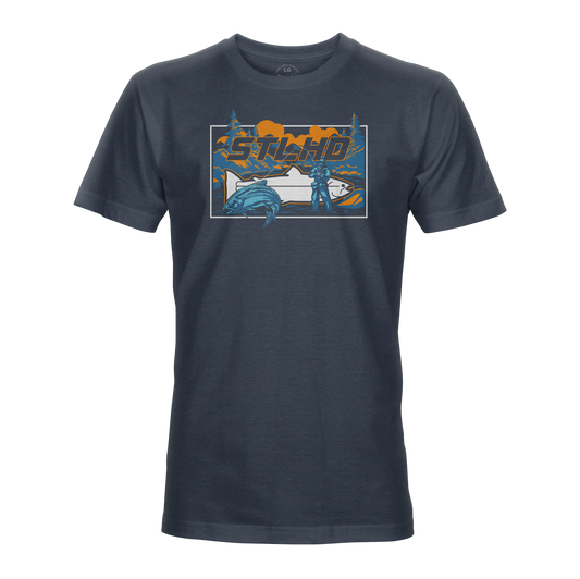 The STLHD Let’er Rip T-Shirt by STLHD GEAR is a dark blue tee featuring a bold psycho graphic with a person, car, and leaping fish. Made from breathable comfort weave for all-day wear.