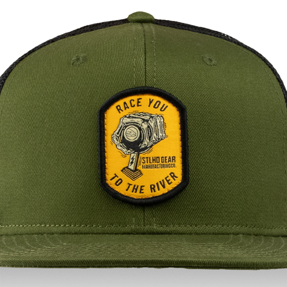 The STLHD Race Ya Flat Bill Trucker Hat by STLHD GEAR is olive green with a yellow and black RACE YOU TO THE RIVER patch, piston graphic, mesh back, and adjustable snapback for comfort.