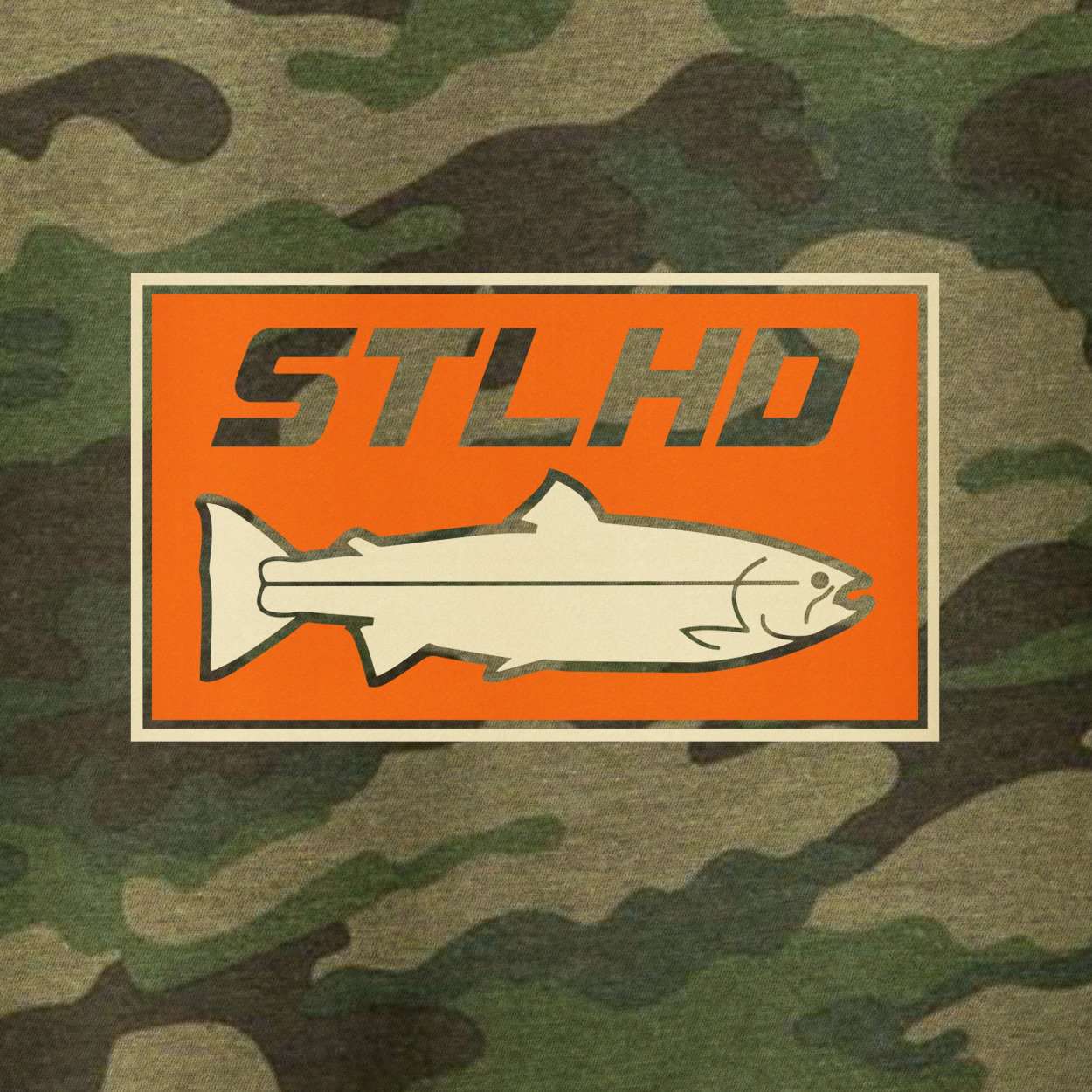The STLHD Mens Woodlands Camo Standard Hoodie by STLHD GEAR features a Woodlands Camo design with an orange rectangle displaying the STLHD logo above a stylized fish outline, all bordered by a beige frame.