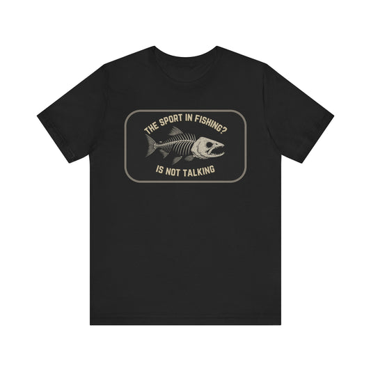The Sport in Fishing?” Tee by Printify: Black unisex shirt with a distressed fish skeleton print and the phrase “The sport in fishing? Is not talking” above and below the graphic.