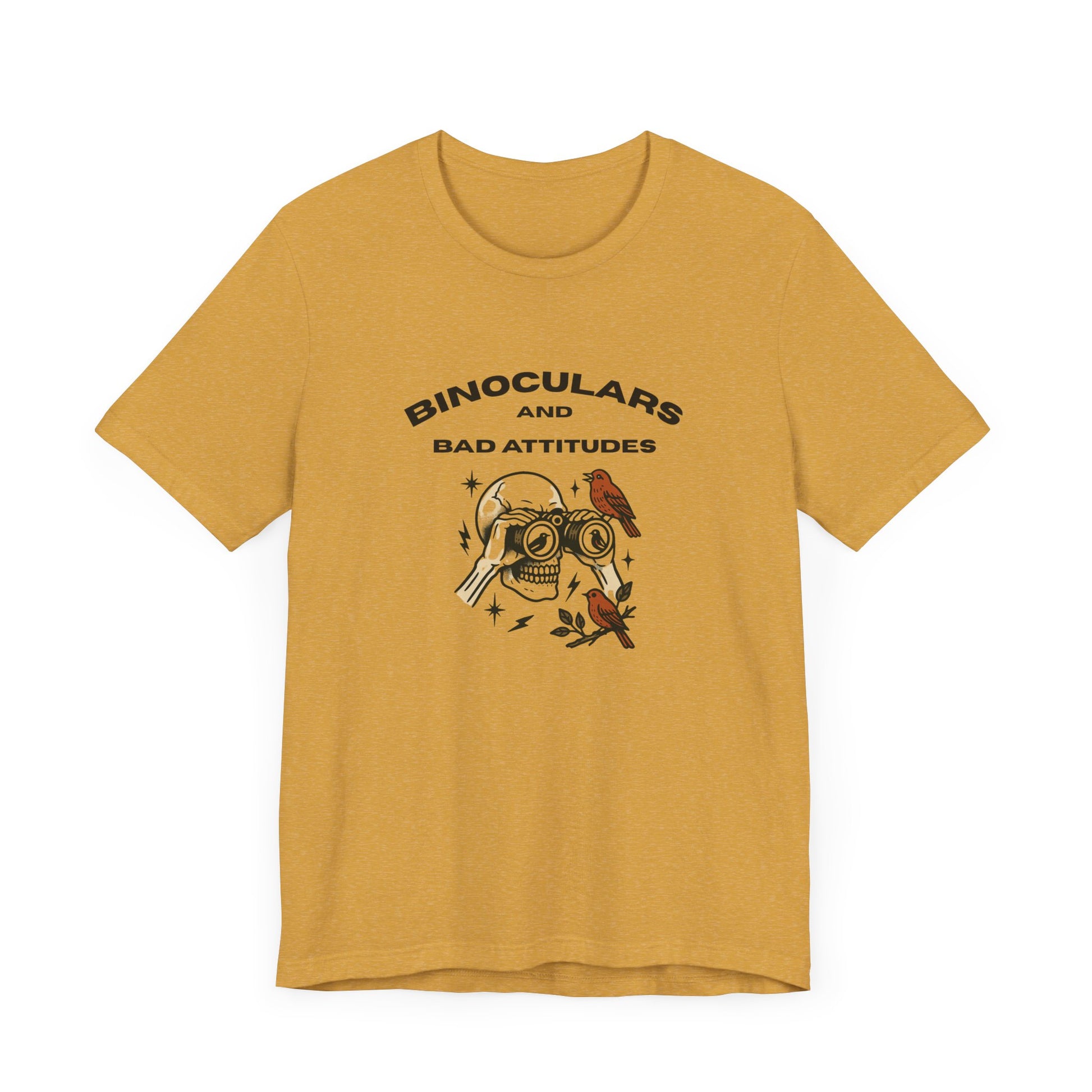 The Bird Watching Is Hardcore T-Shirt by Printify is a funny punk birder shirt for misfits and field freaks, featuring a yellow design with an illustrated skull, binocular eyes, bird, and “BINOCULARS AND BAD ATTITUDES” text.