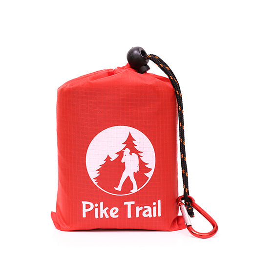 The Pike Trail Pocket Blanket is a compact, rugged red pouch with a black and orange cord, metal carabiner, and hiker/tree logo—ideal for any adventure.