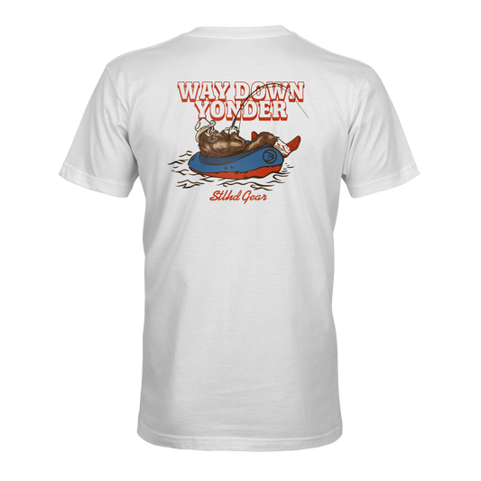 White t-shirt with a graphic design on the back featuring  Way down yonder STLHD GEAR text and an image of bigfoot with cowboy boots and hat fishing from a raft in a body of water.