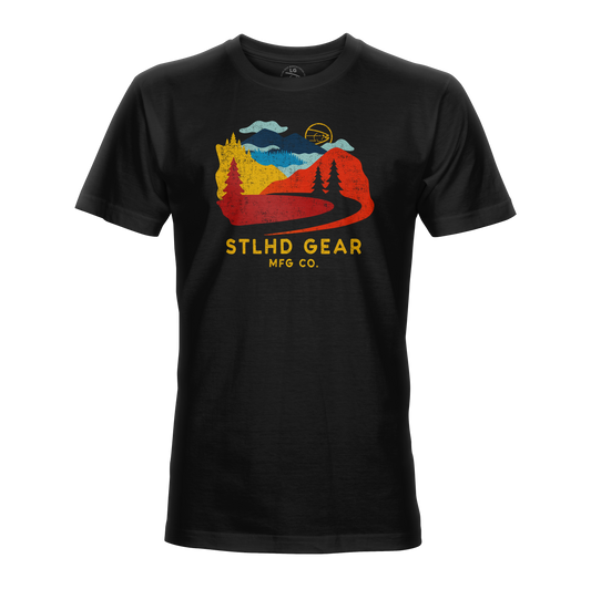 Black t-shirt with colorful Journey graphic and 'STLHD GEAR MFG CO.' text on a white background