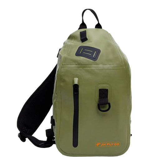 The JHFLYCO 20L Waterproof Sling Pack by Jackson Hole Fly Company features a green, waterproof design with black zippers and straps, vertical zip pocket, D-ring loop, and orange logo—streamlined for fishing essentials.