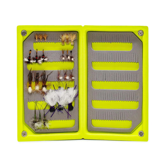 The Jackson Hole Fly Company JHFLYCO Loaded Foam Fly Box features a yellow, rectangular case open to reveal essential dry fly patterns for trout in rows on the left, with empty grooves on the right for extra flies.