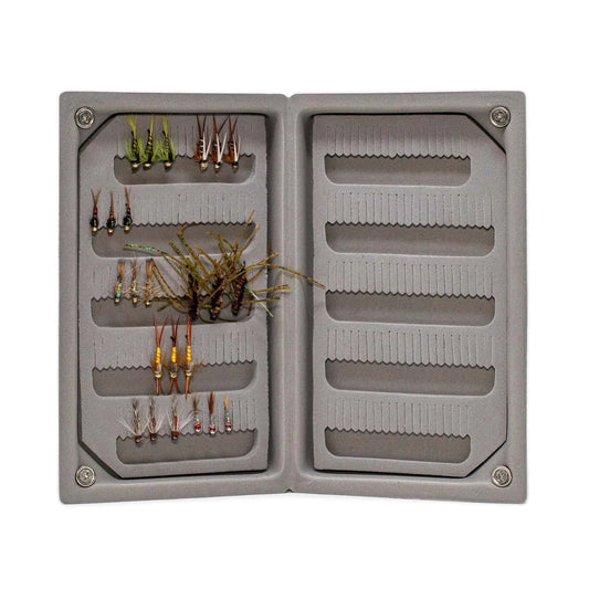 The Jackson Hole Fly Company JHFLYCO Loaded Foam Fly Box – Standard Nymph Assortment features neatly organized trout nymphs on the left, with empty slots on the right for adding more flies.