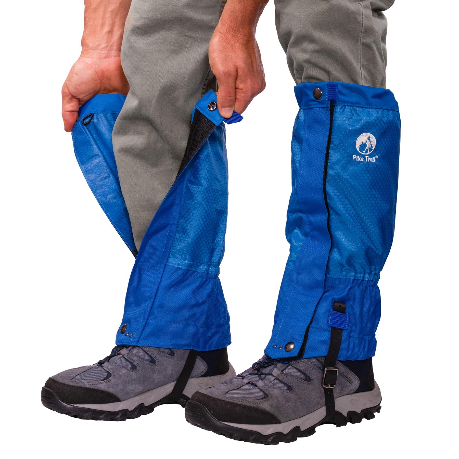 A person wearing gray pants and hiking shoes secures Pike Trail All-Season Waterproof Leg Gaiters—built for the trail, the hunt, and everything in between—over their lower legs with snaps and Velcro.