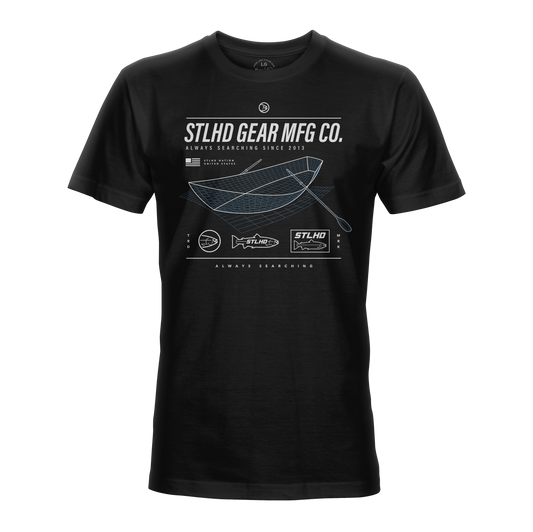 Black t-shirt with white STLHD GEAR MFG CO. and scans of a drift boat graphics and text on a white background