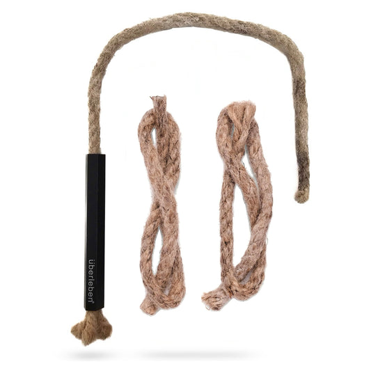 The Überleben Tindår Wick & Bellow Kit includes a black handle with a rope teaser and two replacement rope teasers, all made of brown, textured natural fibers similar to waterproof hemp wick.